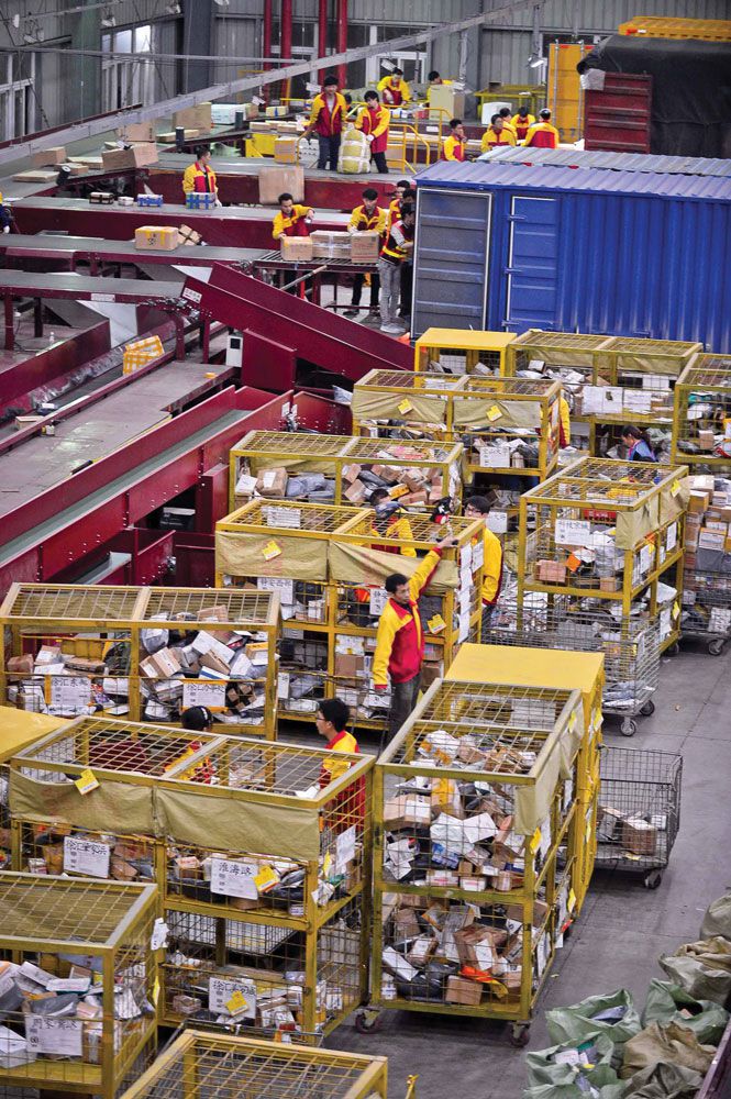 At a Shanghai distribution line for the Yunda courier company, workers toil all night long to meet demand over Singles' Day